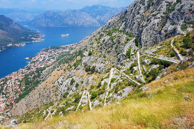 Hiking downhill from Krstac to Kotor, visit San Giovanni fortress - Spiljari village stop: local family tastings and a real-life pause